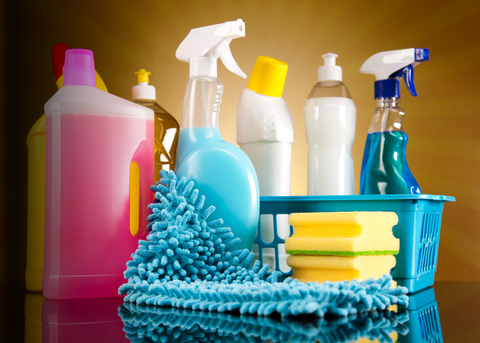 Household essentials like kitchen utensils, storage containers, and cleaning supplies on retail shelves.