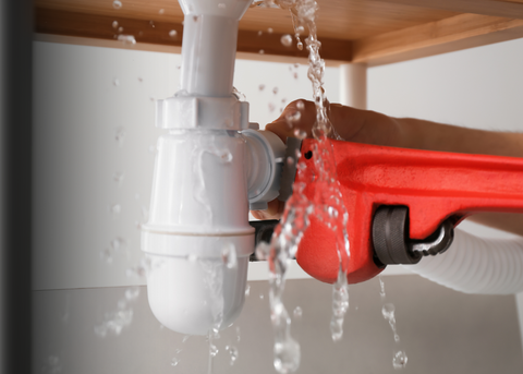Plumbing supplies including pipes, fittings, faucets, and repair tools for residential plumbing needs.